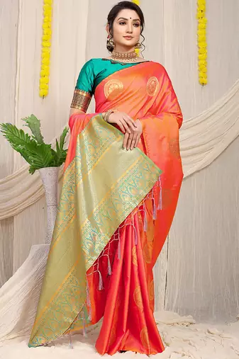 Peach silk blend saree with turquoise zari border and circular motifs
