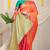 Peach silk blend saree with turquoise zari border and circular motifs