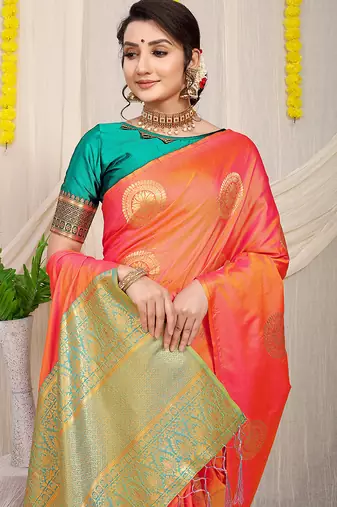 Peach silk blend saree with turquoise zari border and circular motifs