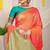 Peach silk blend saree with turquoise zari border and circular motifs