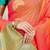 Peach silk blend saree with turquoise zari border and circular motifs