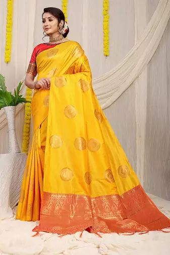 Mustard yellow silk blend saree with red zari border and circular motifs