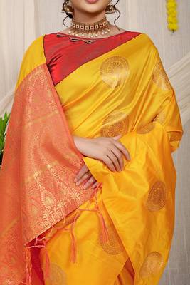 Mustard yellow silk blend saree with red zari border and circular motifs 4