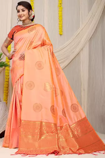 Light peach silk blend saree with rust orange zari border and circular motifs