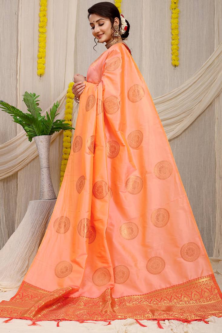 Light peach silk blend saree with rust orange zari border and circular motifs