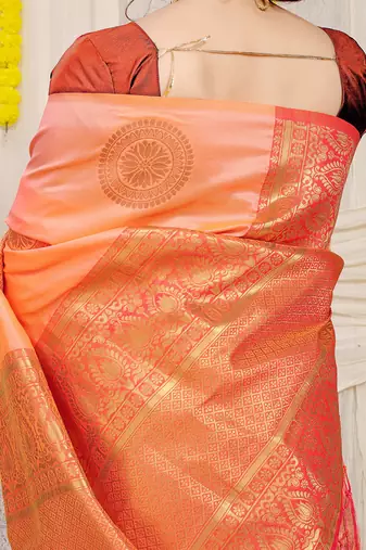 Light peach silk blend saree with rust orange zari border and circular motifs