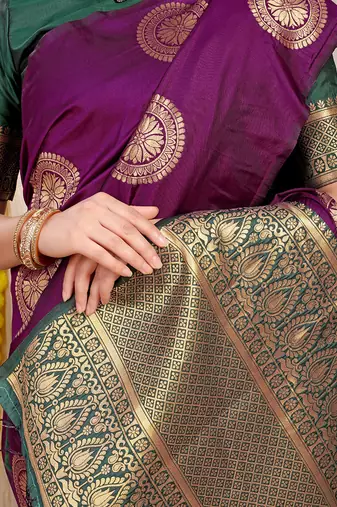 Wine purple silk blend saree with bottle green zari border and circular motifs