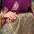 Wine purple silk blend saree with bottle green zari border and circular motifs