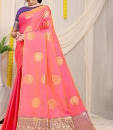 Pink silk blend saree with purple zari border and circular motifs