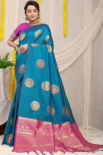 Teal blue silk blend saree with magenta pink zari border and circular motifs
