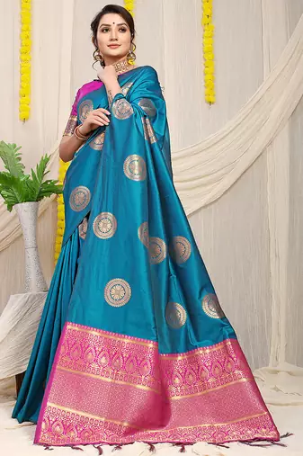 Teal blue silk blend saree with magenta pink zari border and circular motifs
