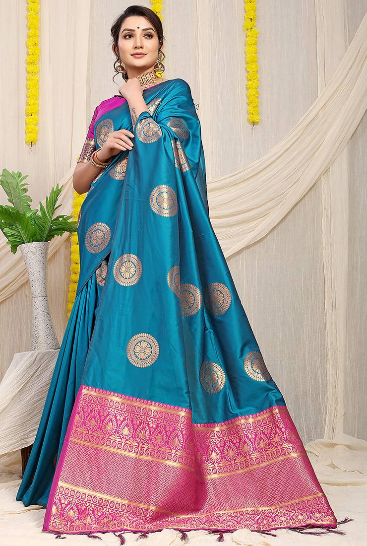 Teal blue silk blend saree with magenta pink zari border and circular motifs