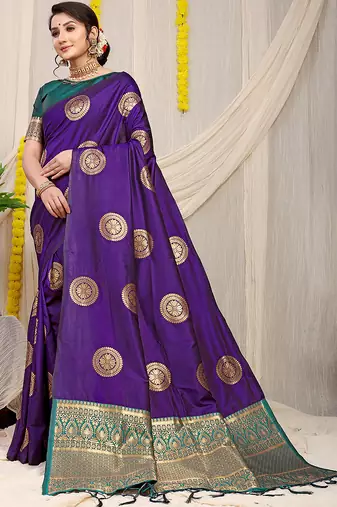 Purple silk blend saree with teal zari border and circular motifs