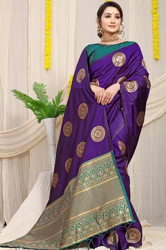 Purple silk blend saree with teal zari border and circular motifs