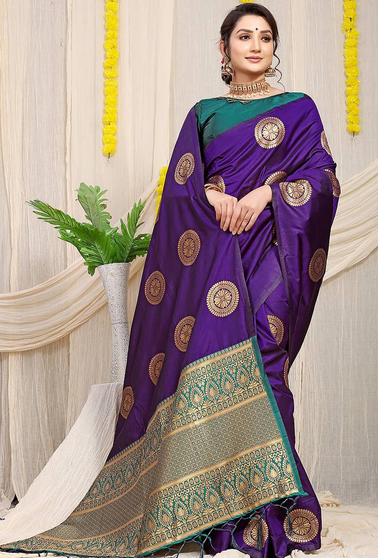 Purple silk blend saree with teal zari border and circular motifs