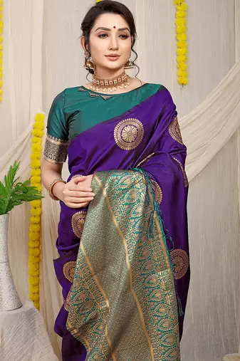 Purple silk blend saree with teal zari border and circular motifs