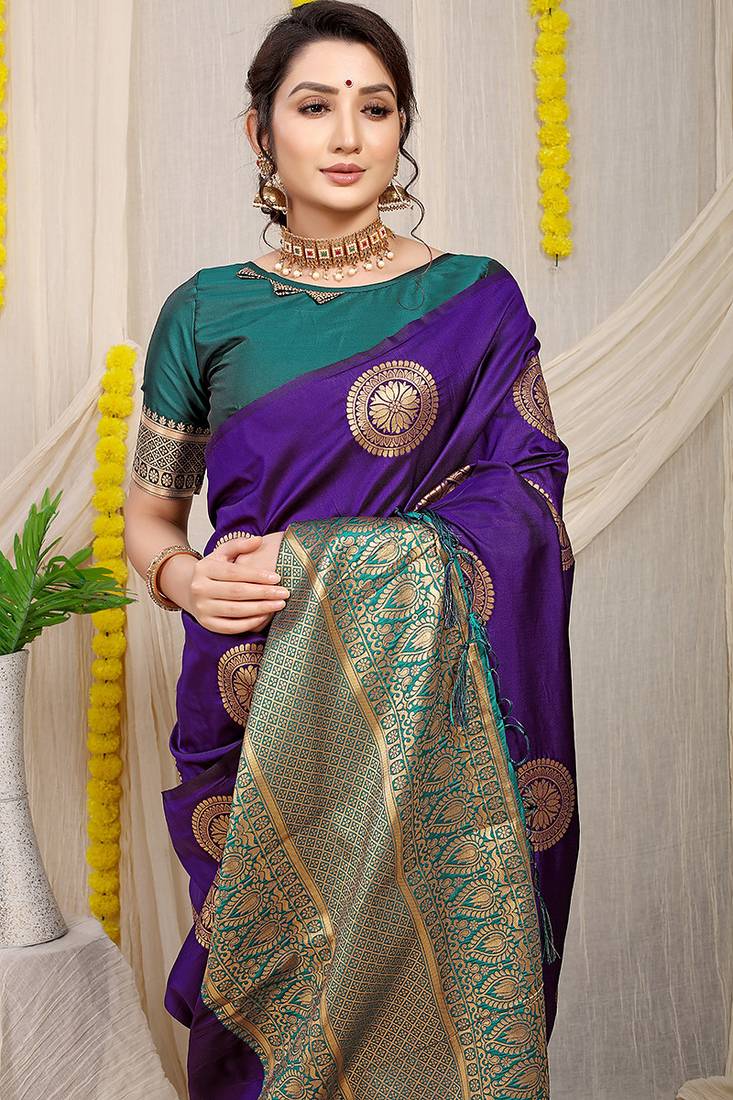 Purple silk blend saree with teal zari border and circular motifs