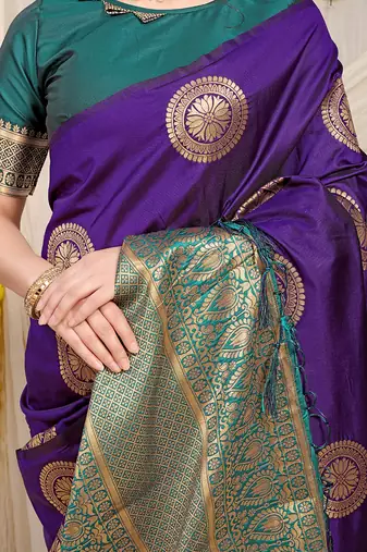 Purple silk blend saree with teal zari border and circular motifs