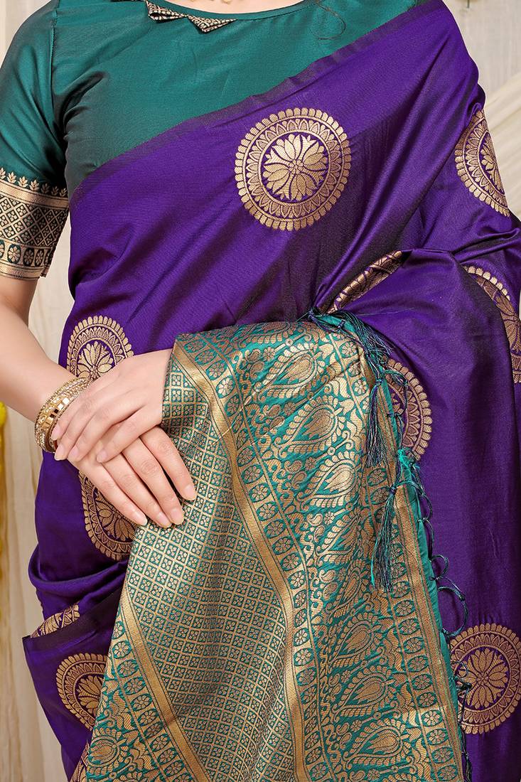 Purple silk blend saree with teal zari border and circular motifs