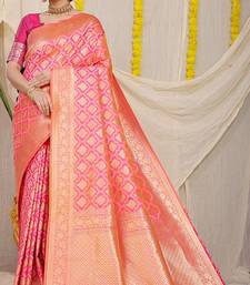 Rani pink woven banarasi silk blend saree with blouse piece
