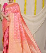 Rani pink woven banarasi silk blend saree with blouse piece