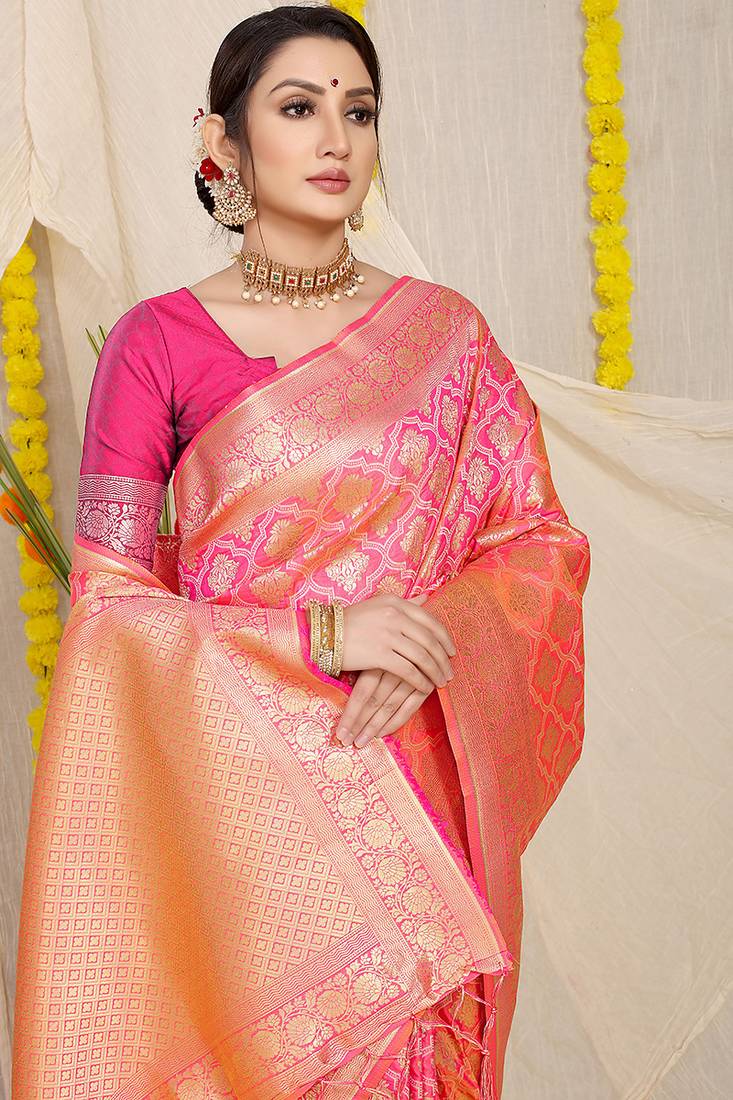 Rani pink woven banarasi silk blend saree with blouse piece