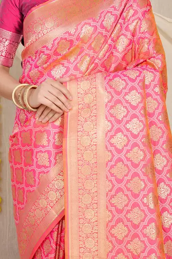Rani pink woven banarasi silk blend saree with blouse piece