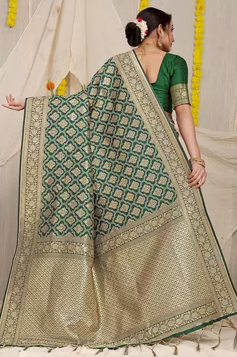 Dark green woven banarasi silk blend saree with blouse piece