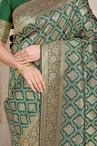 Dark green woven banarasi silk blend saree with blouse piece