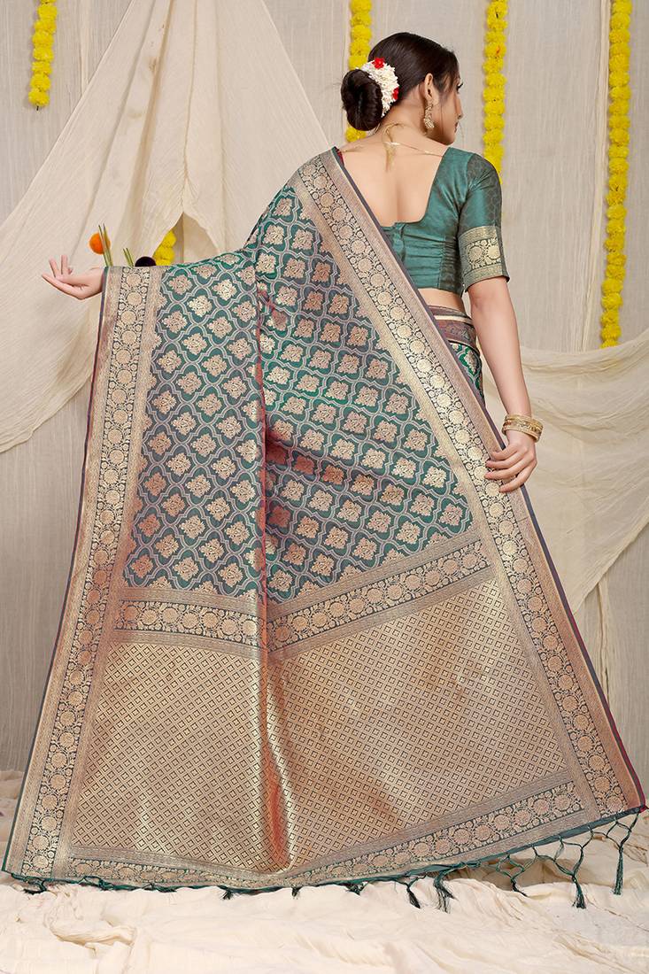 Teal green woven banarasi silk blend saree with blouse piece