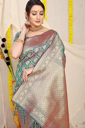 Teal green woven banarasi silk blend saree with blouse piece