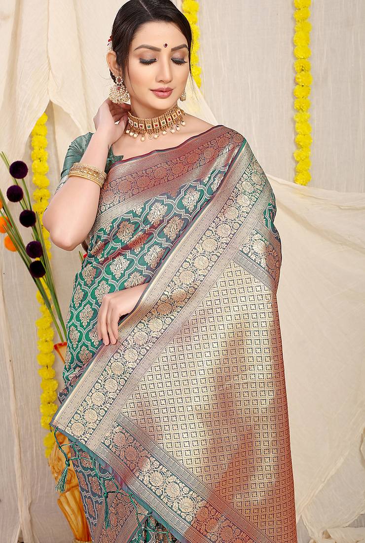 Teal green woven banarasi silk blend saree with blouse piece