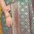 Teal green woven banarasi silk blend saree with blouse piece