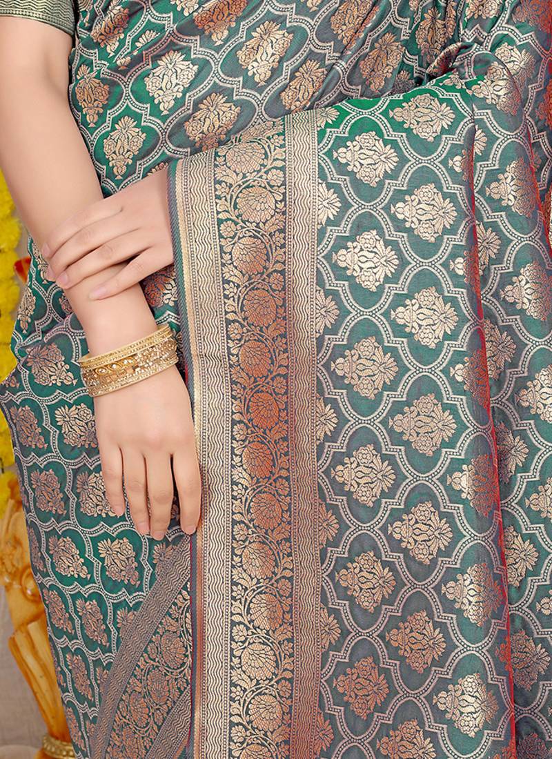 Teal green woven banarasi silk blend saree with blouse piece