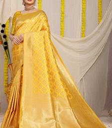 Yellow woven banarasi silk blend saree with blouse piece