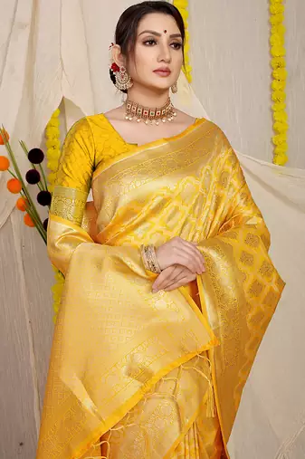 Yellow woven banarasi silk blend saree with blouse piece