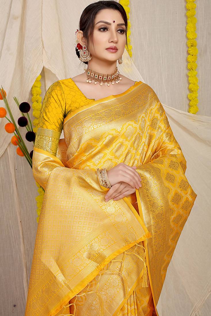 Yellow woven banarasi silk blend saree with blouse piece