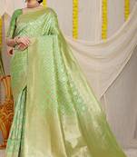 Light green woven banarasi silk blend saree with blouse piece