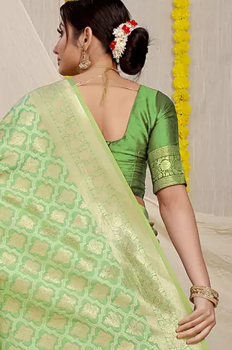 Light green woven banarasi silk blend saree with blouse piece