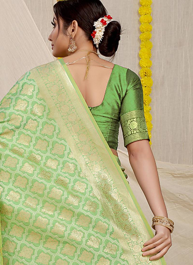 Light green woven banarasi silk blend saree with blouse piece