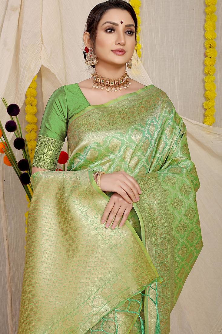 Light green woven banarasi silk blend saree with blouse piece