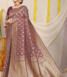 Wine woven banarasi silk blend saree with blouse piece