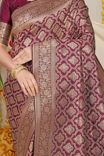 Wine woven banarasi silk blend saree with blouse piece