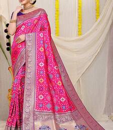 Rani pink patola silk blend zari woven saree with blouse piece