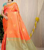 Orange kanjivaram silk blend zari woven saree with turquoise zari border