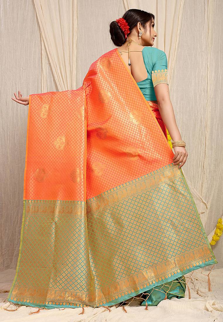 Orange kanjivaram silk blend zari woven saree with turquoise zari border