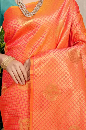 Orange kanjivaram silk blend zari woven saree with turquoise zari border
