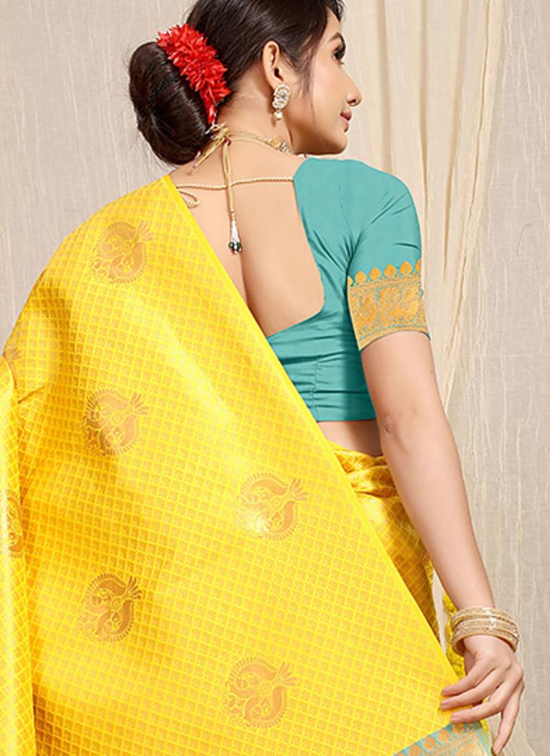 Yellow kanjivaram silk blend zari woven saree with turquoise zari border