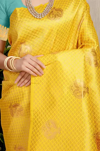 Yellow kanjivaram silk blend zari woven saree with turquoise zari border