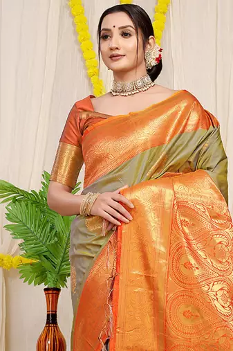 Light olive green silk blend kanjivaram saree with orange zari border